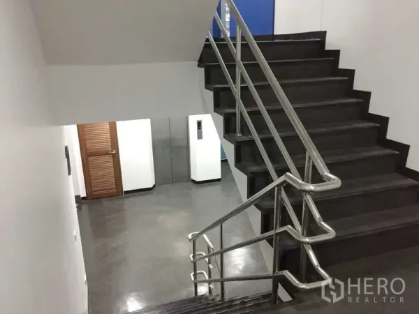 Office Space for rent in Khlong Toei, Bangkok - Internal staircase with stainless-steel handrails leading to the corridor and lift lobby.