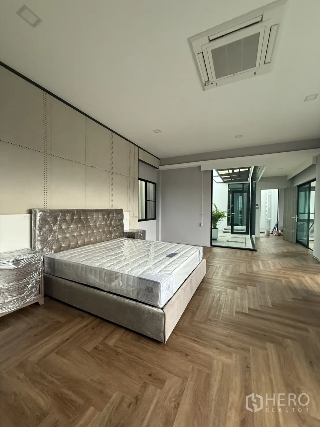 Detached House for rent in Saphan Sung, Bangkok - Upper-floor window view across greenery and a low-rise neighborhood.