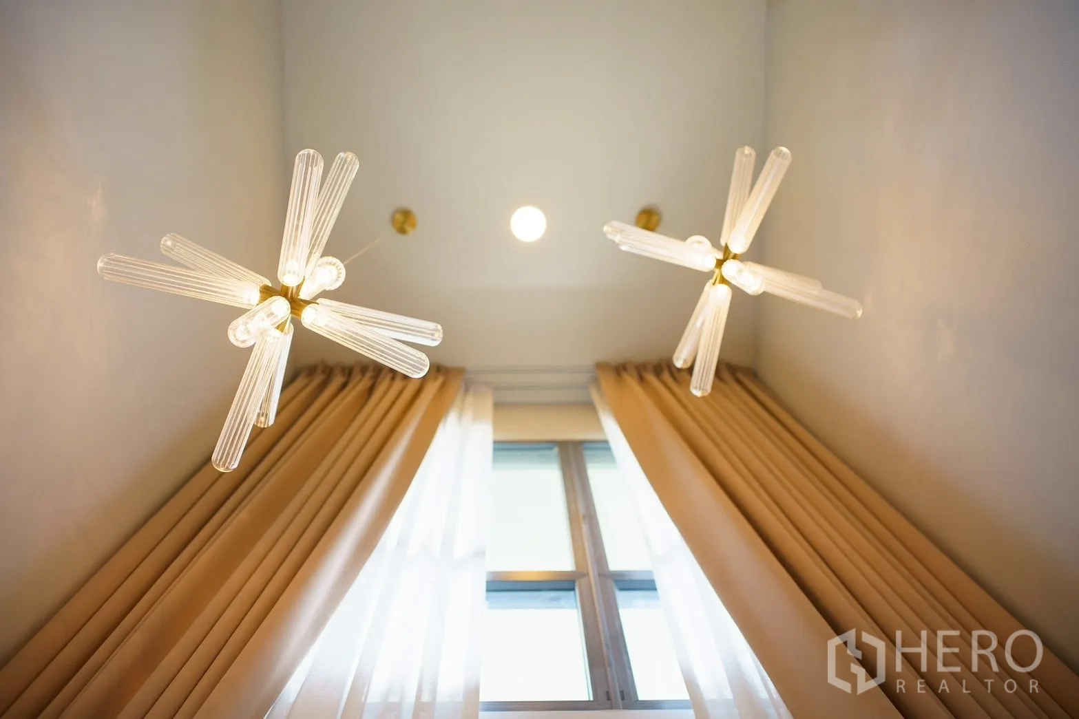 Detached House for sale in Bang Phli, Samut Prakan - Double-height foyer with modern sputnik chandeliers and tall drapes