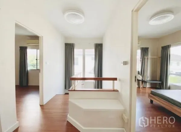 Detached House for rent or sale - Upper landing with wood stairs, balcony doors and entrances to bedrooms filled with natural light.