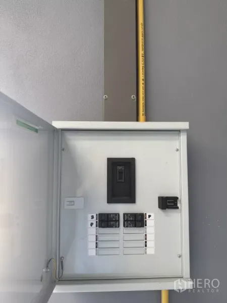 Warehouse for rent in Bang Phli, Samut Prakan - Close-up of the warehouse electrical control panel with breakers and conduit.