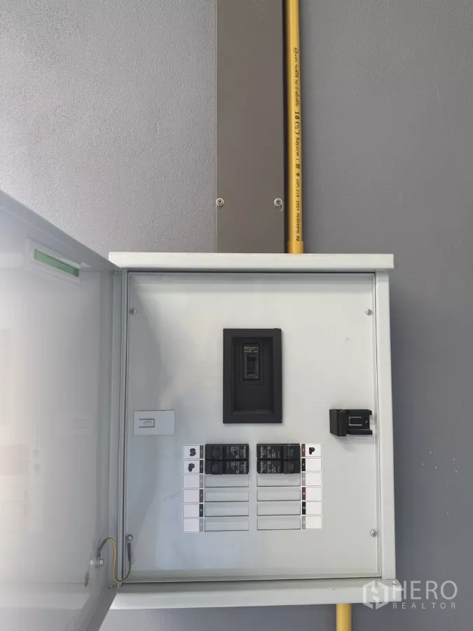 Warehouse for rent in Bang Phli, Samut Prakan - Close-up of the warehouse electrical control panel with breakers and conduit.