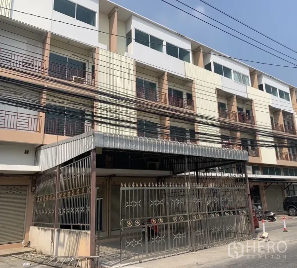 Home Office for rent in Lat Krabang, Bangkok - Front exterior of two adjoining 4.5‑storey home‑office buildings with gated forecourt and balconies.