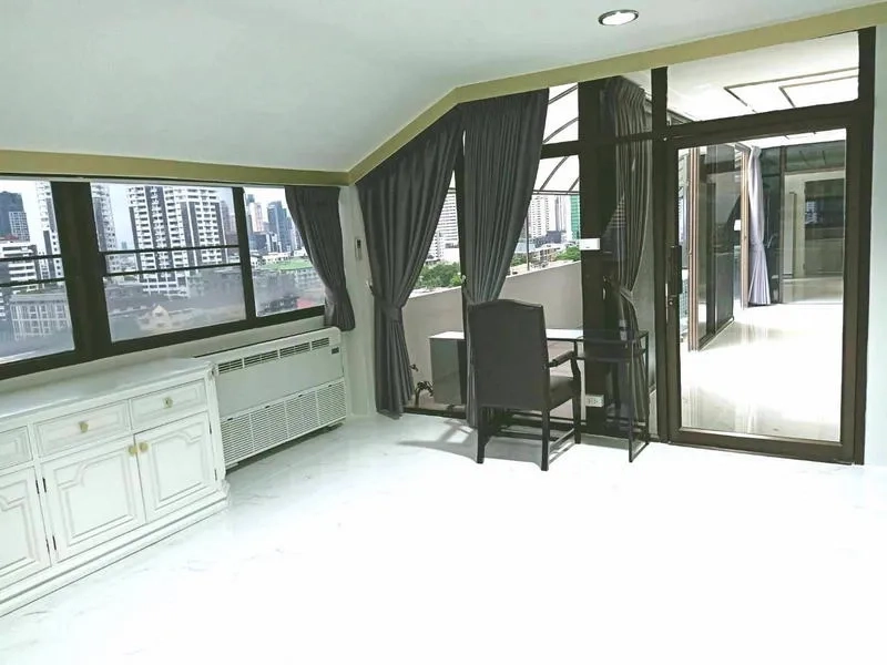 Condominium for  in Watthana, Bangkok - Corner room with wraparound windows and door to outdoor terrace.