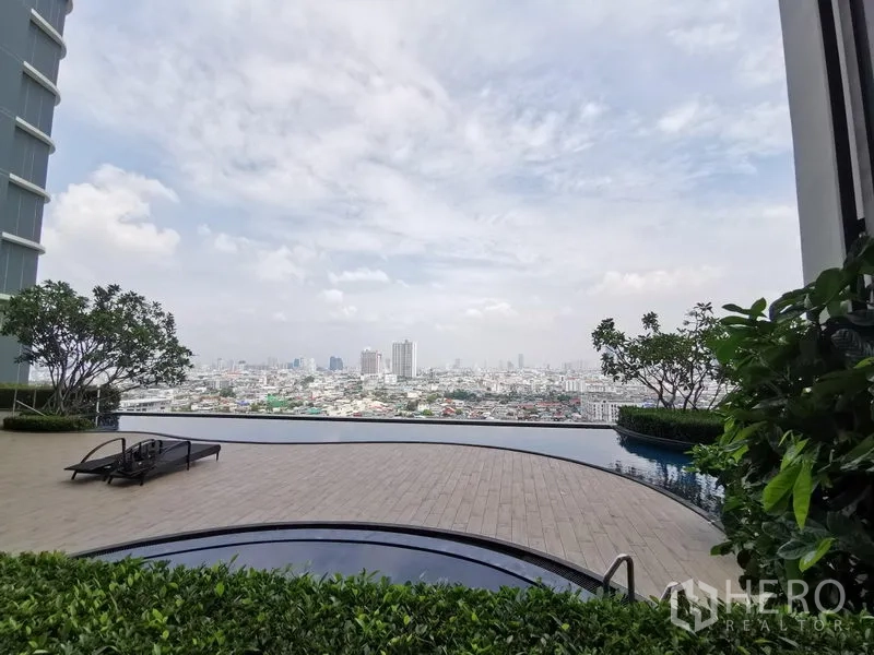 Condominium for rent in Bang Kho Laem, Bangkok - Infinity-edge pool deck with city panorama and landscaped seating areas.