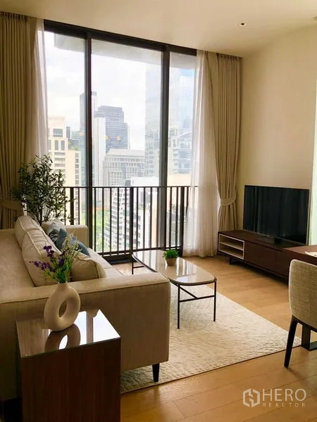 Condominium for rent - Cozy living room with sofa, TV console and large windows with city views.