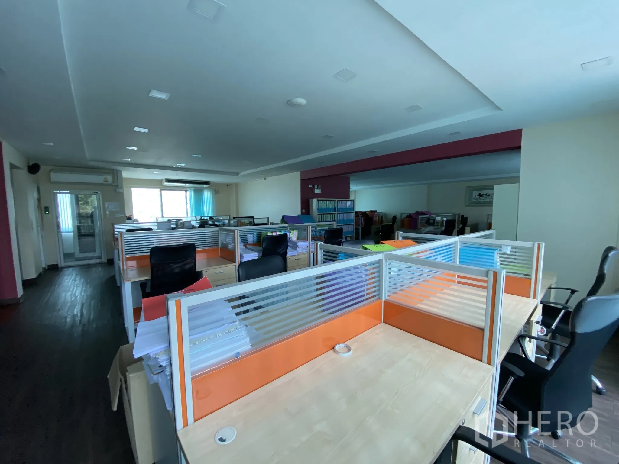 Home Office for rent or sale in Bang Phli, Samut Prakan - Bright office floor showing rows of cubicles and task chairs.