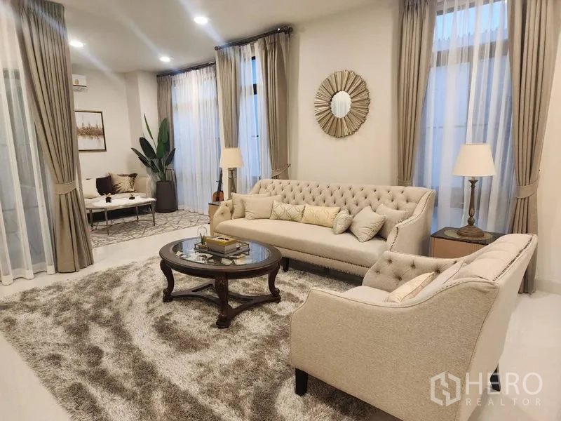 Detached House for rent or sale - Formal living area with tufted sofas, round coffee table and plush rug