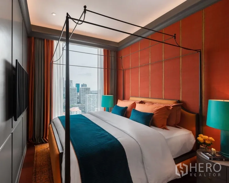 Condominium for sale in Watthana, Bangkok - Bedroom with canopy bed, warm paneled wall, and sweeping city views.