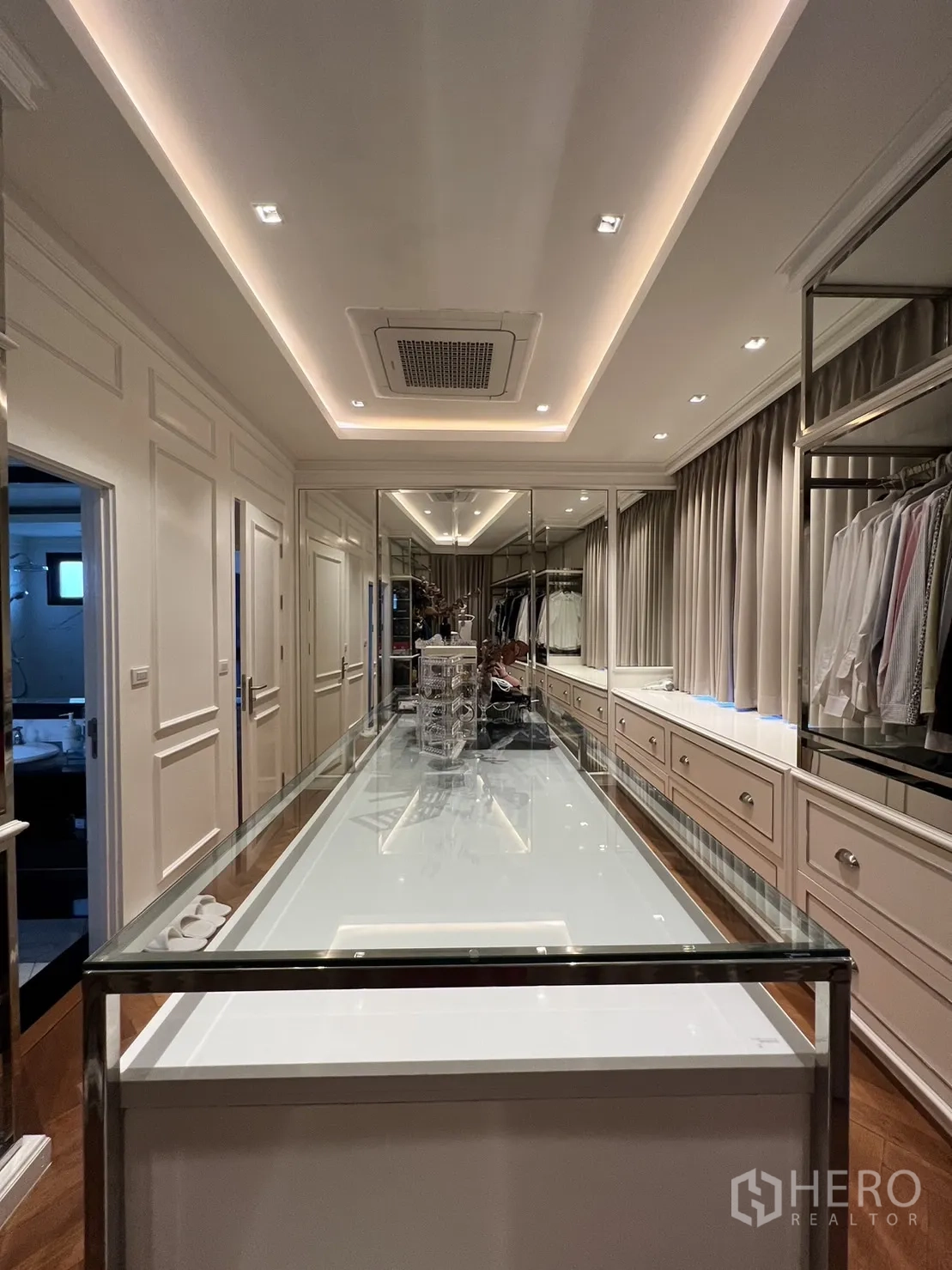 Detached House for rent in Suan Luang, Bangkok - Long view of walk-in closet with mirrored wall and ceiling lights.