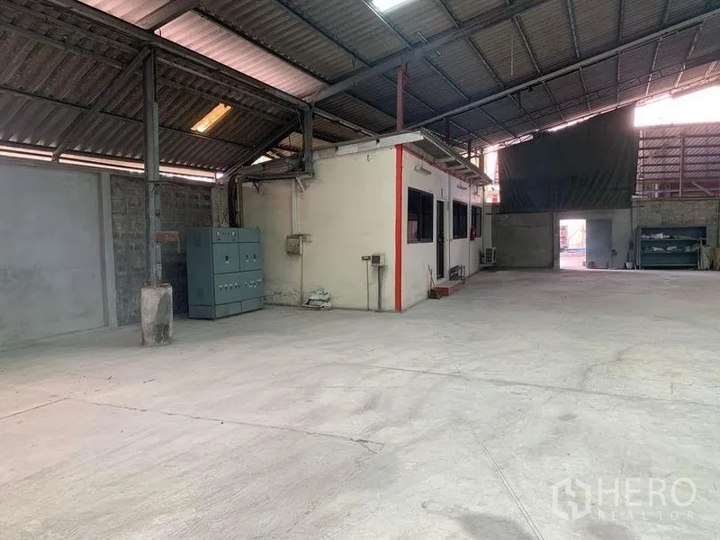 Warehouse for rent - Internal office block within the warehouse featuring windows and an entry door.
