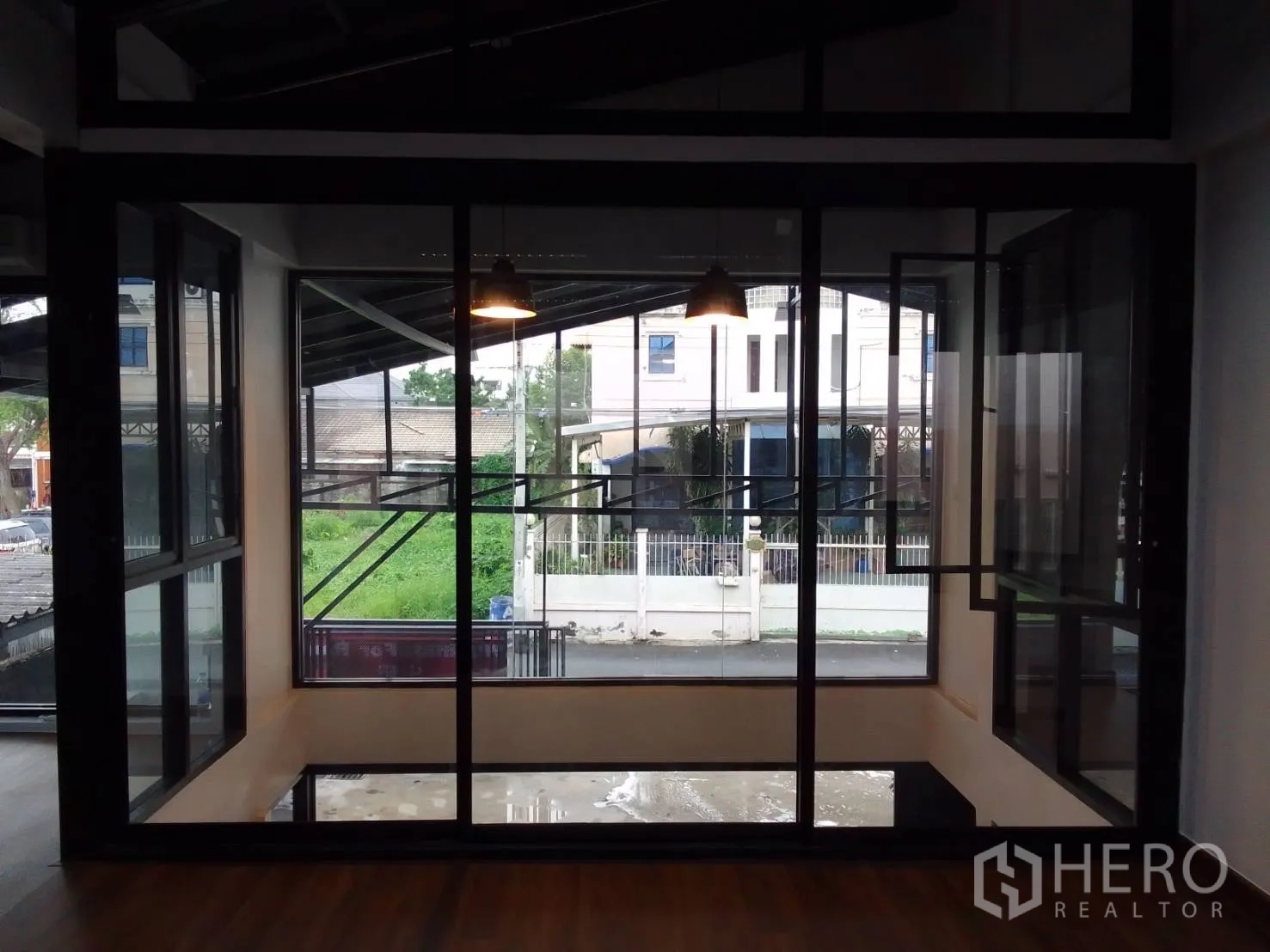 Home Office for rent in Wang Thonglang, Bangkok - Alternate view of glass corner room with opening windows and black frames