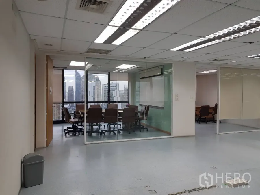 Office Space for rent in Bang Na, Bangkok - Glass-walled meeting room with skyline views inside a high-rise office in Khlong Toei.