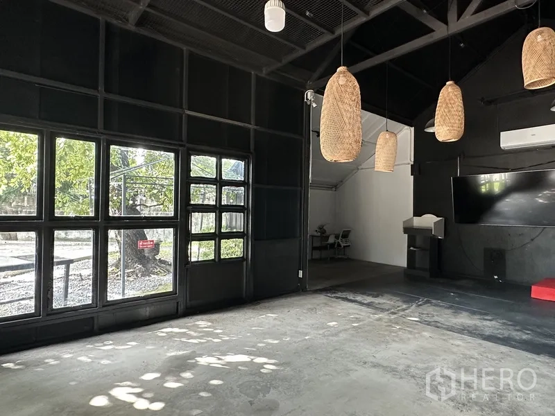Retail Space for rent in Phra Khanong, Bangkok - Spacious hall with multiple rattan pendant lights and grid windows.