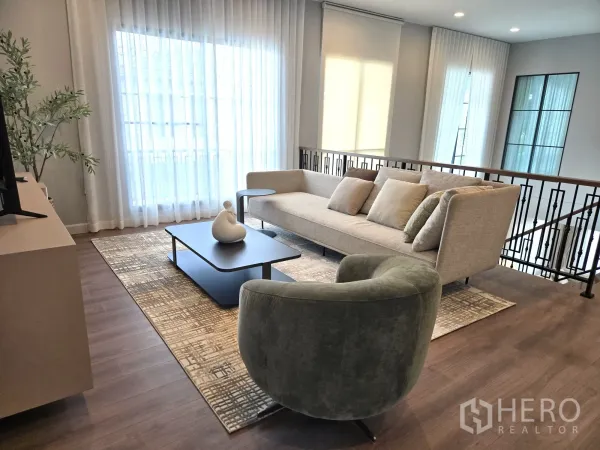 Detached House for rent in Bang Phli, Samut Prakan - Upstairs family lounge with sofa set, coffee table and sheer drapes.