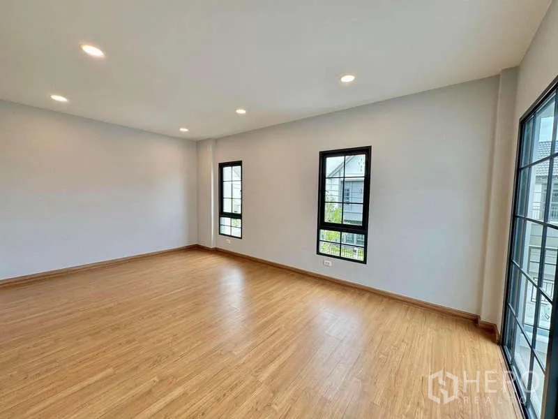 Detached House for sale in Bang Phli, Samut Prakan - Large bedroom with tall windows and recessed lighting.