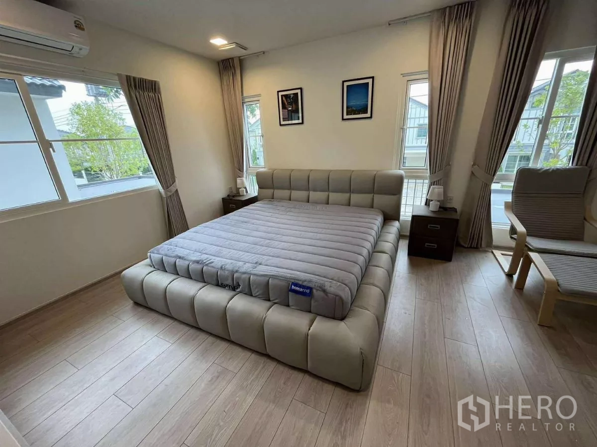 Detached House for rent in Bang Phli, Samut Prakan - Bedroom with panoramic windows, upholstered bed, and bedside tables.