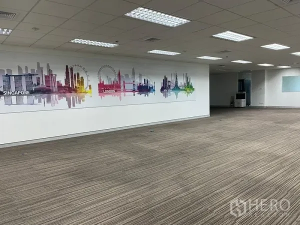 Office Space for rent - Large open-plan office with carpet tiles, grid ceiling lights and a colorful city skyline mural on the wall.