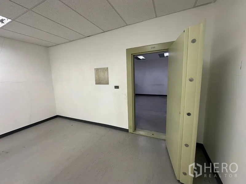 Office Space for rent - Secure vault room with a heavy reinforced safe door inside the office premises.
