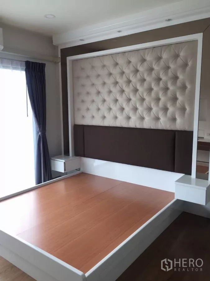 Detached House for rent in Samut Prakan - Master bedroom with upholstered tufted headboard and platform bed frame.