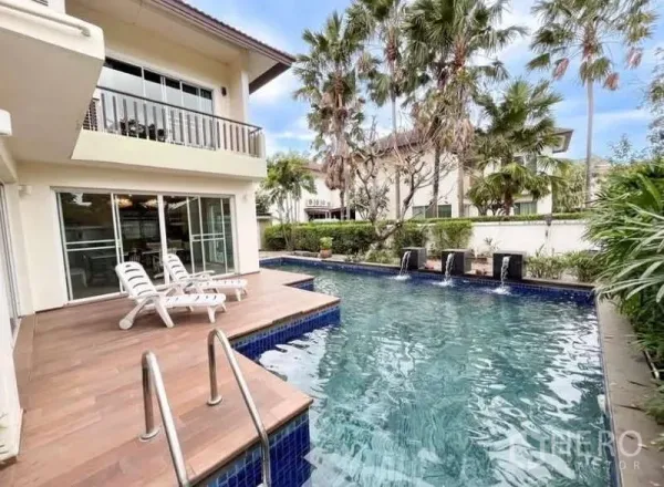 Detached House for rent in Bang Phli, Samut Prakan - Private swimming pool with blue tiles, water features and sun deck with loungers by sliding glass doors.