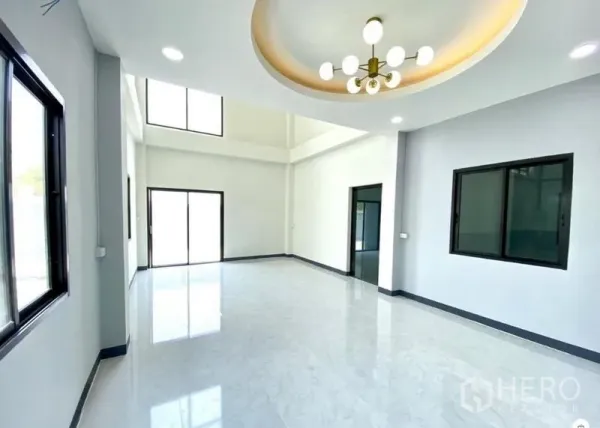 Warehouse for rent in Lat Lum Kaeo, Pathum Thani - Bright office or showroom area with large windows, sliding doors and a feature chandelier.