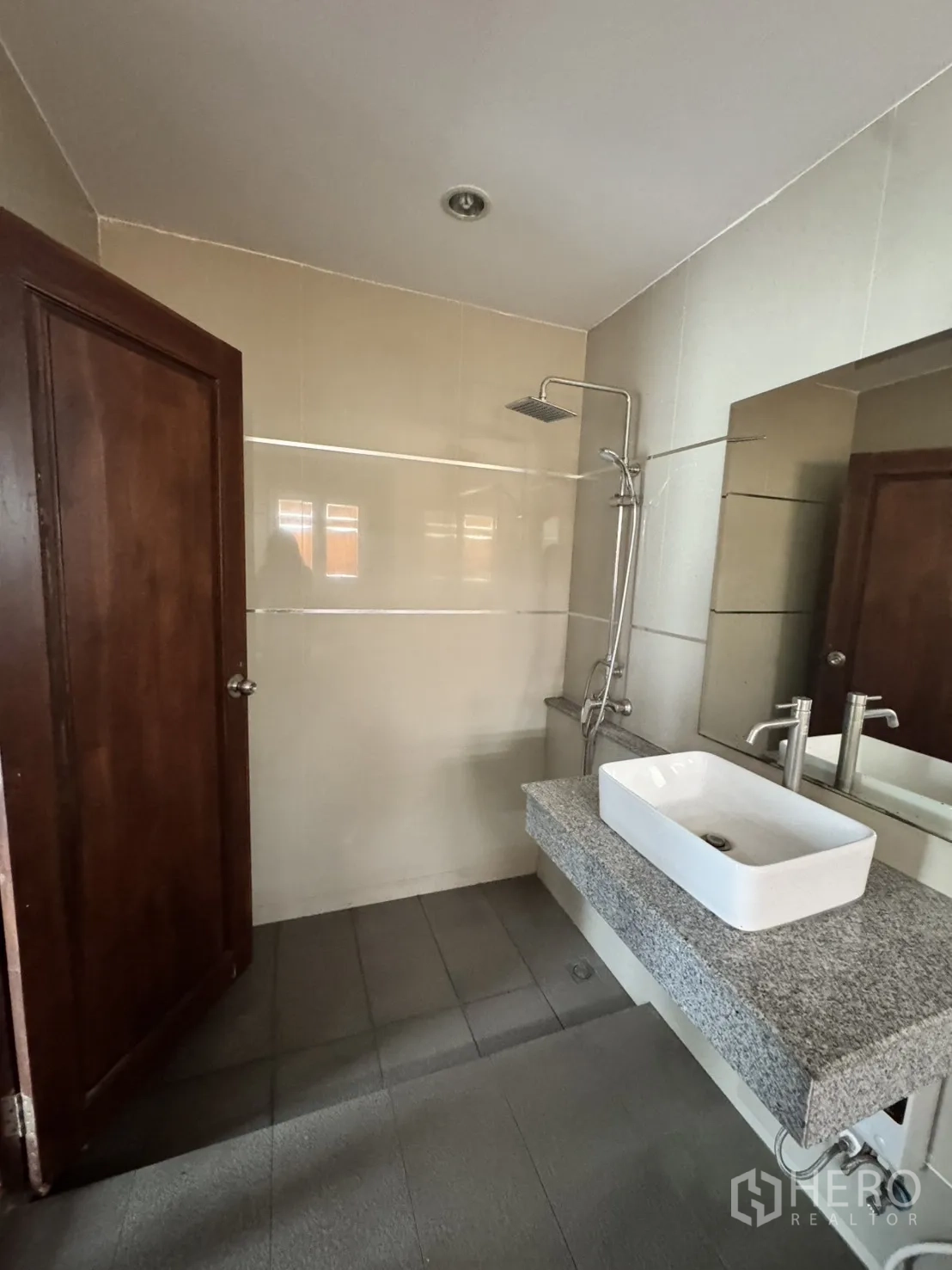 Home Office for rent in Watthana, Bangkok - Bathroom with rain shower and granite counter featuring a vessel sink.