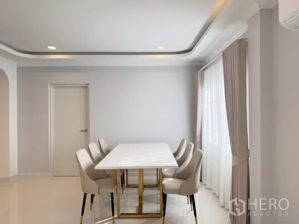Detached House for rent or sale in Bang Phli, Samut Prakan - Elegant dining room with marble-top table and six upholstered chairs.