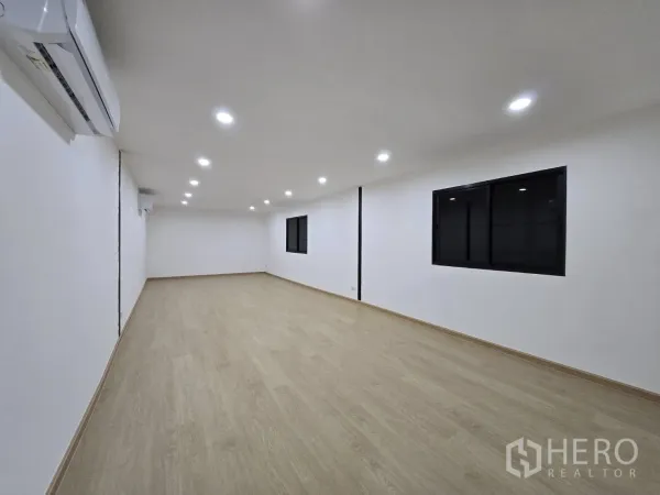 Warehouse for rent - Bright upstairs office room with wood-look flooring, recessed lights and air-conditioning installed.