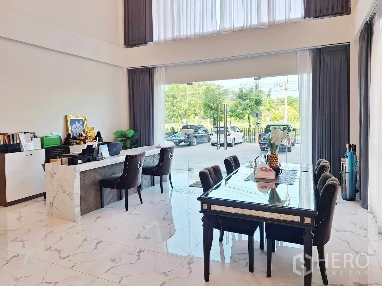 Home Office for sale in Bueng Kum, Bangkok - Front reception and meeting area with floor-to-ceiling glass facing greenery and parking.