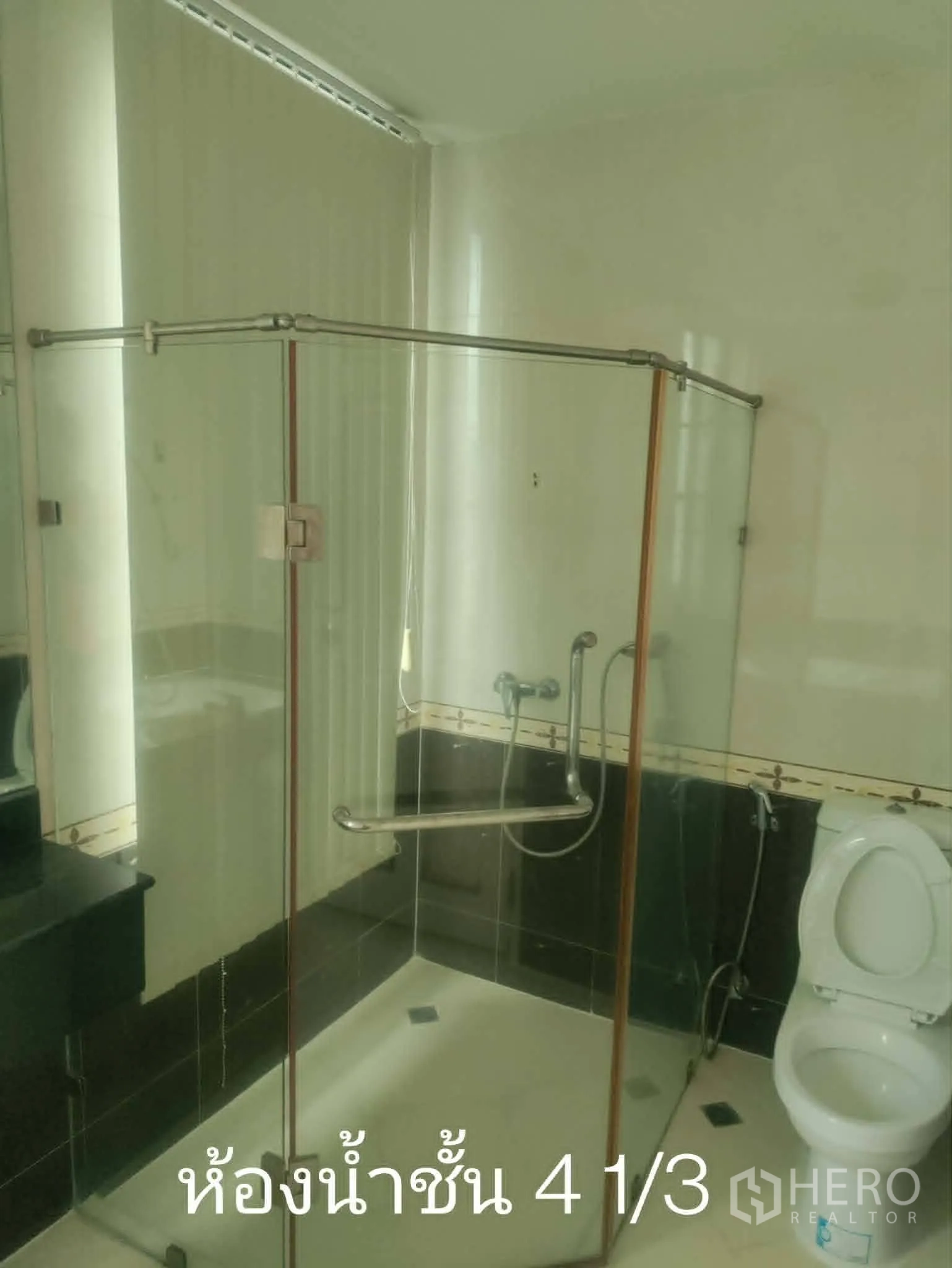 Home Office for rent in Lat Phrao, Bangkok - Bathroom with glass-enclosed shower, toilet, and vanity.