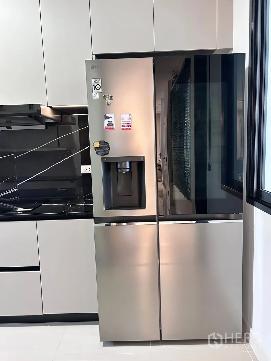 Semi-detached House for rent in Bang Phli, Samut Prakan - Stainless steel side-by-side refrigerator integrated with modern cabinetry.