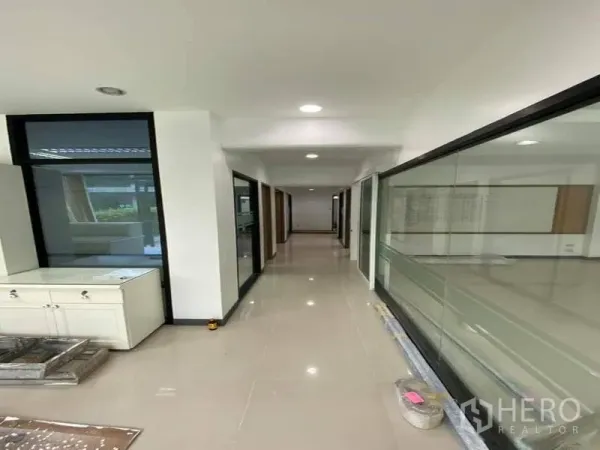 Office Space for rent in Suan Luang, Bangkok - Long corridor lined with glass-partitioned private offices.