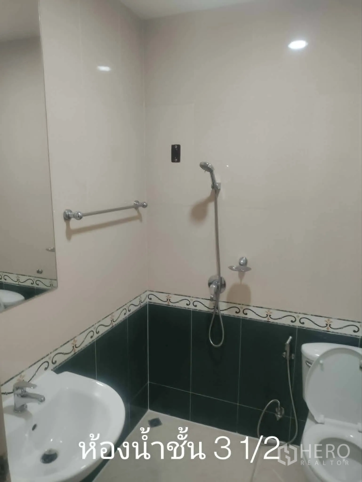Home Office for rent in Lat Phrao, Bangkok - Another tiled bathroom with handheld shower, sink, and toilet.