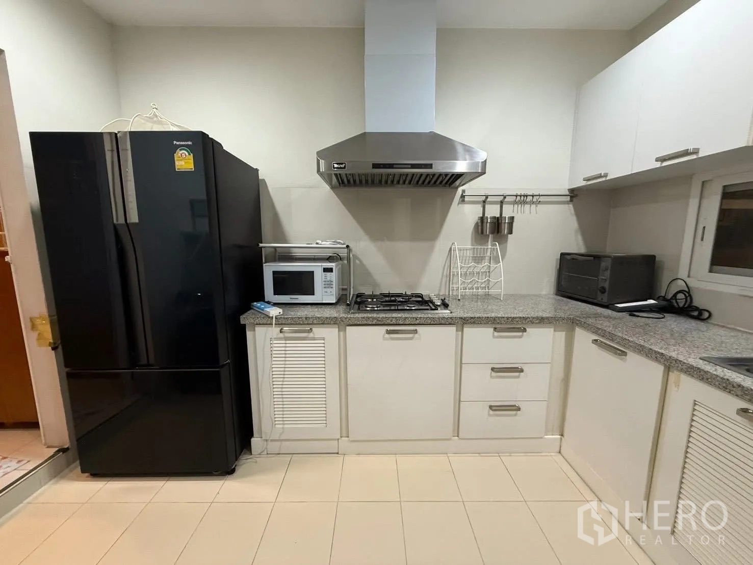 Detached House for rent in Bang Na, Bangkok - Another angle of the Thai kitchen with large fridge and appliances.