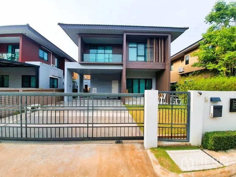 Detached House for sale in Pathum Thani - Modern two-storey detached house with a gated driveway, carport and front lawn.