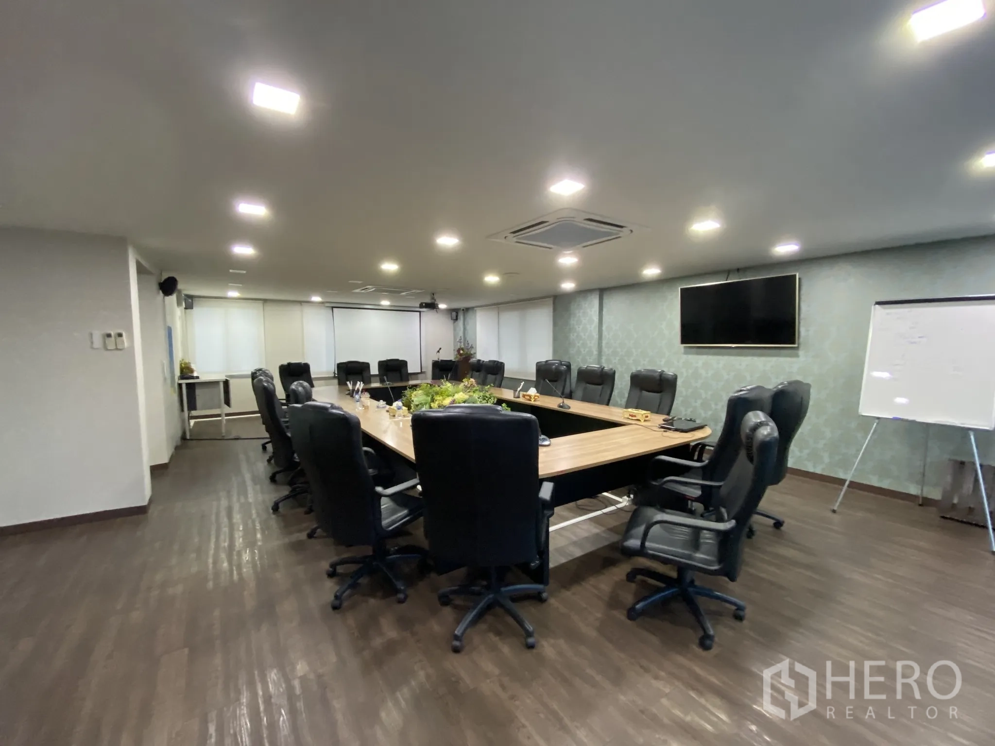 Home Office for rent or sale in Bang Phli, Samut Prakan - Boardroom with long conference table, leather chairs and wall‑mounted TV.