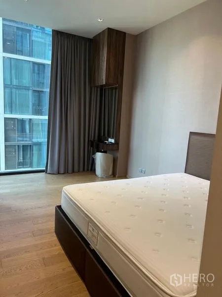 Condominium for rent - Bedroom with queen-size bed, floor-to-ceiling window, and built-in cabinetry.