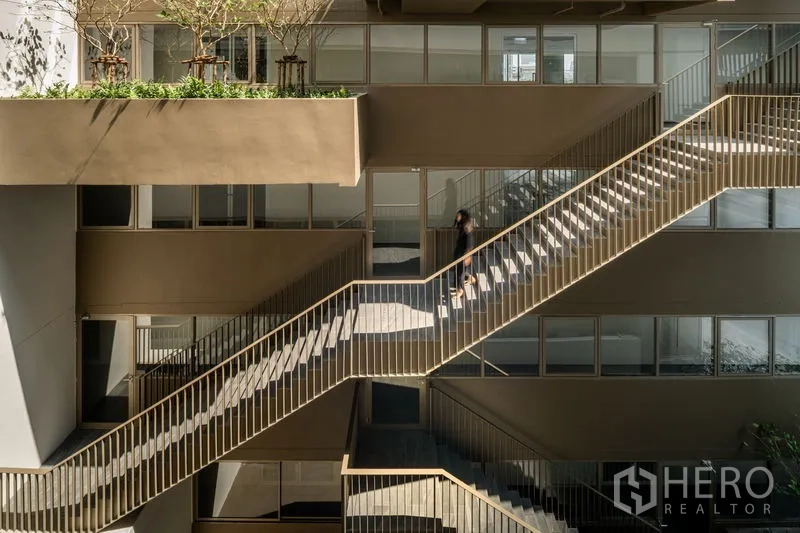 Office Space for rent in Bang Kapi, Bangkok - Exterior staircases linking building levels with planters and glass-fronted offices.