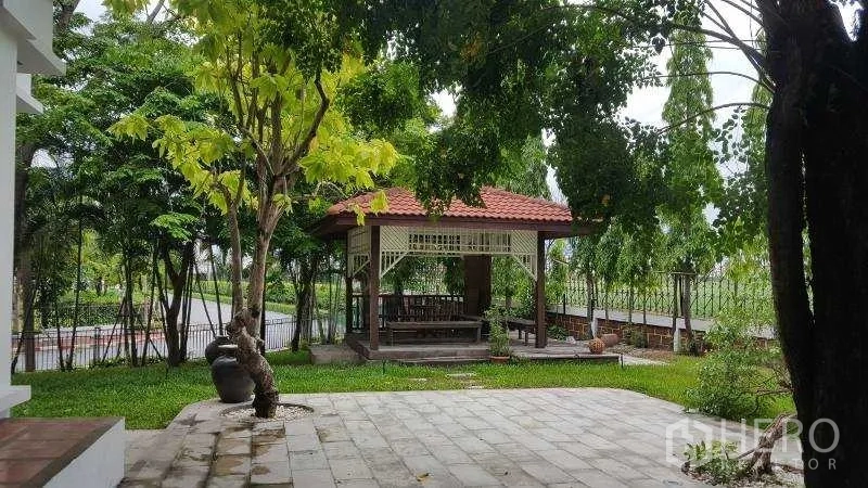 Detached House for rent in Bang Phli, Samut Prakan - Shaded garden patio with mature trees and a pavilion overlooking the lawn.