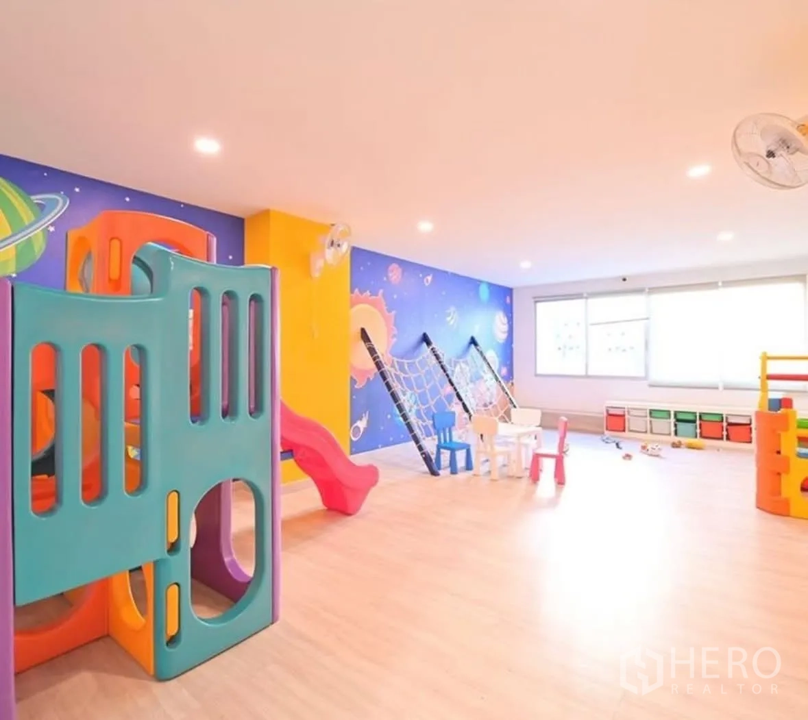 Condominium for rent or sale in Watthana, Bangkok - Colorful indoor children’s playroom with slides and climbing nets.