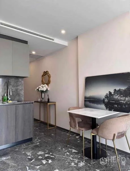 Condominium for rent in Khlong Toei, Bangkok - Cozy dining nook for two beside the kitchen with wall art.