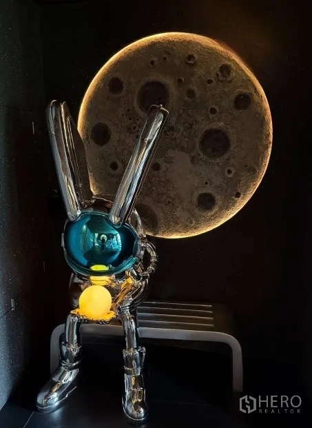 Retail Space for rent in Watthana, Bangkok - Space-themed corner with chrome rabbit sculpture and illuminated moon wall art.