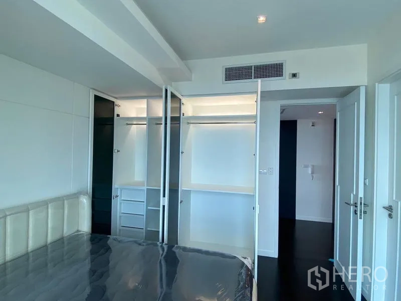 Condominium for rent - Bedroom with open built-in closets and storage.
