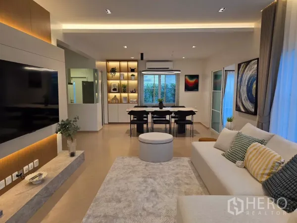 Detached House for rent in Bang Phli, Samut Prakan - View from living to dining area with built-in shelving and warm accent lighting.