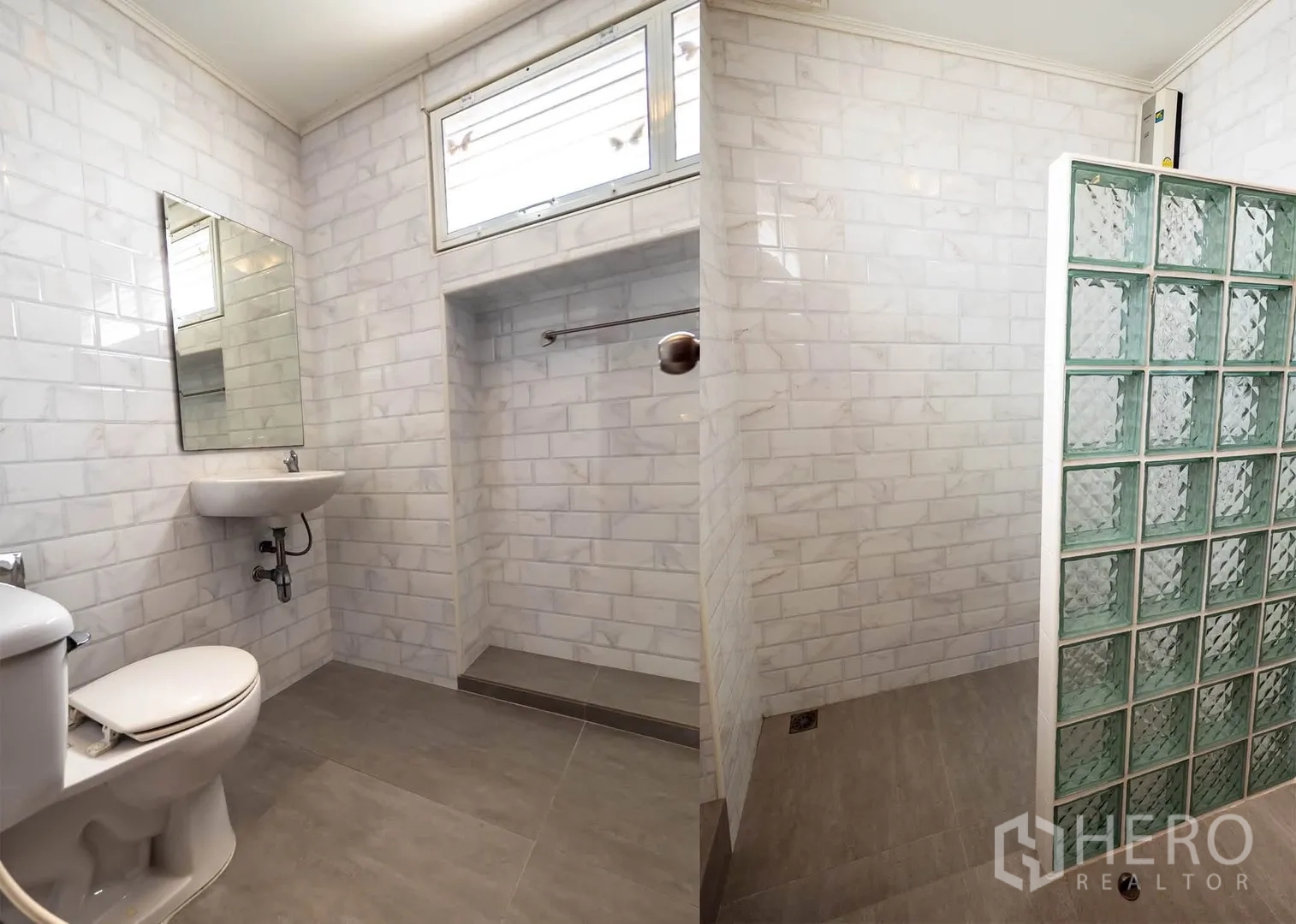 Townhouse for rent in Watthana, Bangkok - Bathroom with white subway tiles, walk-in shower behind glass blocks, toilet, and sink.