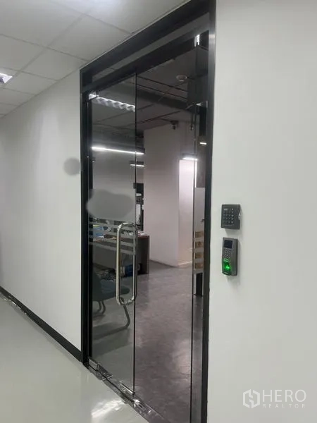 Office Space for rent - Secure glass entry door to the office with keypad and biometric access control.