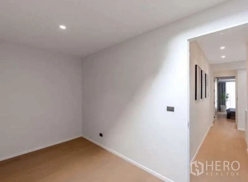 Townhouse for sale in Sathon, Bangkok - Additional room with recessed lighting opening to a hallway toward bedrooms.