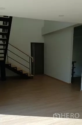 Factory for sale in Bang Bo, Samut Prakan - Office interior with wood-style flooring and metal staircase to the upper level.