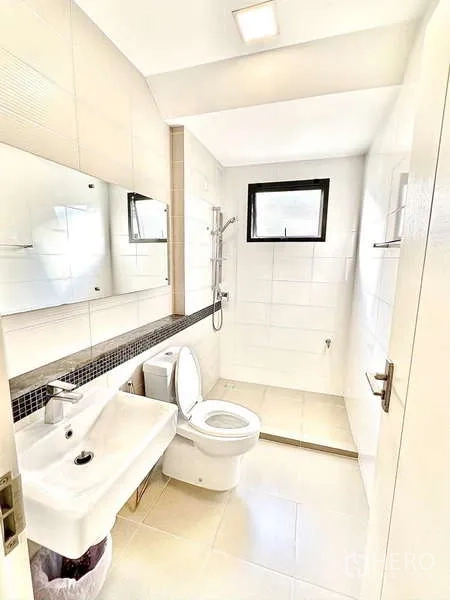 Detached House for sale in Bang Phli, Samut Prakan - Second bathroom with walk-in shower, vanity and wide mirror in neutral tones.